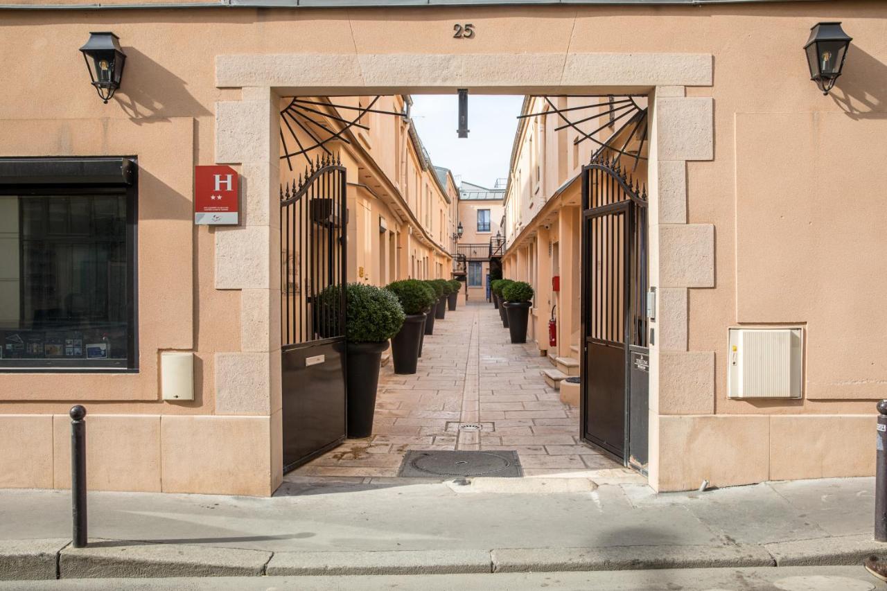 Hotel De L'Horloge Paris Exterior foto